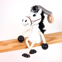 White horse - wooden figure on spring
